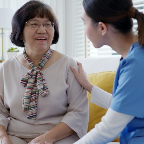 nurse home care hand on senior grandmother shoulder give support empathy